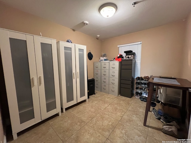 interior space featuring light tile patterned flooring