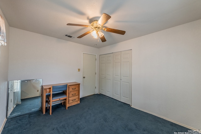 carpeted home office with ceiling fan