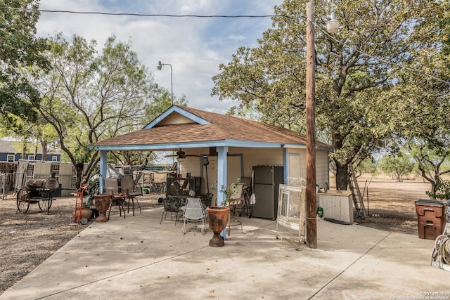 back of property featuring a patio area and ceiling fan