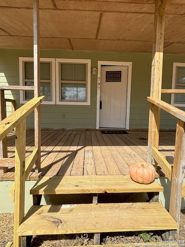 doorway to property with a wooden deck