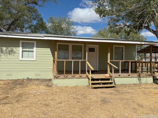 view of front of home featuring a wooden deck