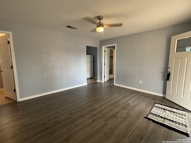 interior space with ceiling fan and dark hardwood / wood-style flooring