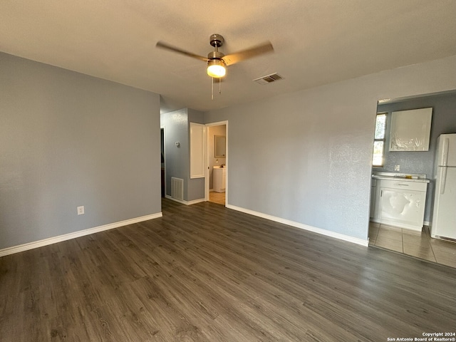 unfurnished room featuring ceiling fan and dark hardwood / wood-style flooring