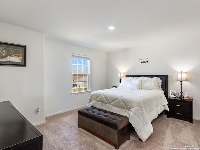 bedroom featuring light carpet