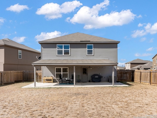 rear view of house featuring a patio