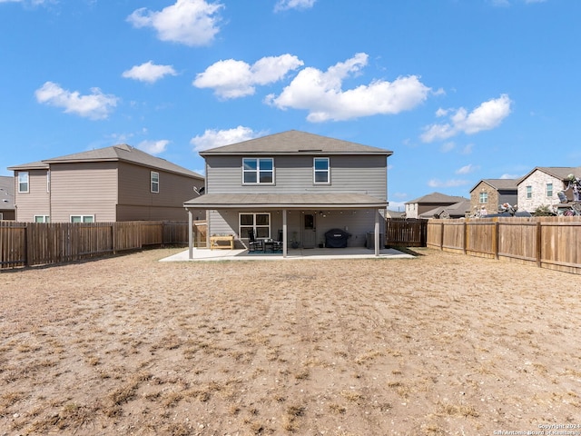 back of property with a patio area