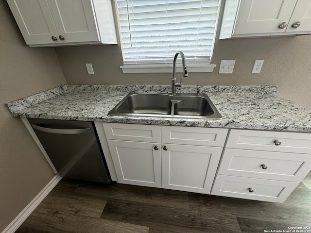 kitchen with sink, dishwasher, white cabinets, and dark hardwood / wood-style flooring