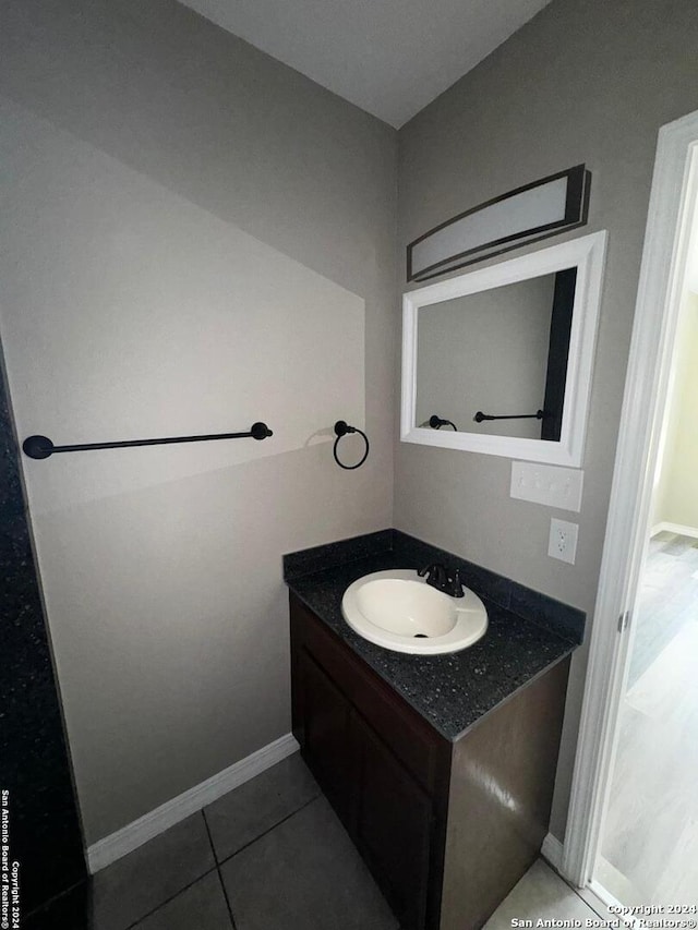 bathroom featuring vanity and tile patterned flooring