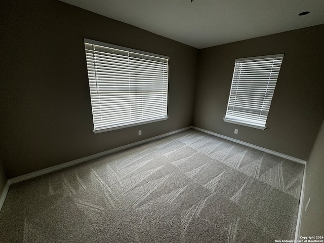 spare room with carpet floors