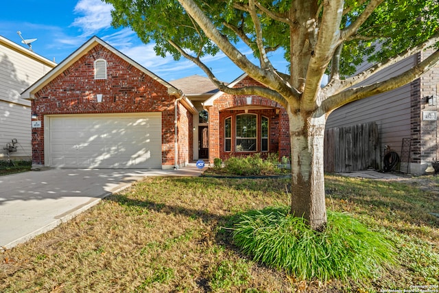 view of front facade featuring a front yard and a garage