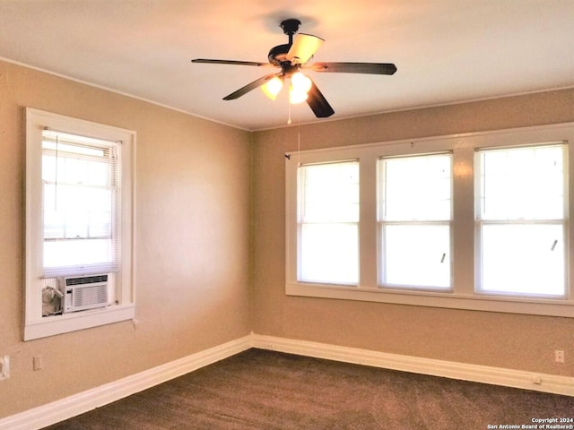 carpeted spare room with ceiling fan and cooling unit