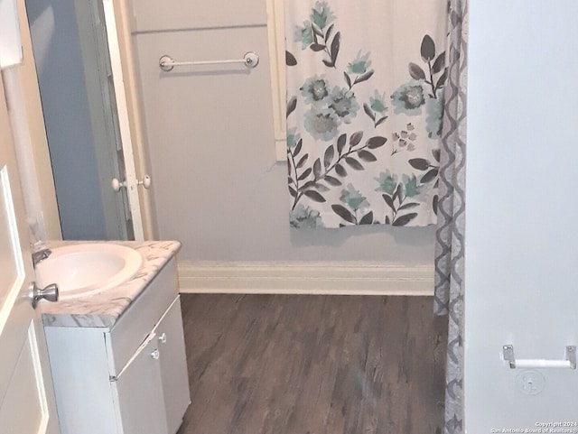 bathroom featuring vanity and hardwood / wood-style floors