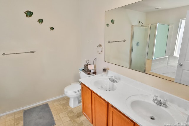 full bathroom with a shower stall, double vanity, toilet, baseboards, and tile patterned floors