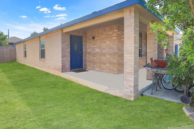 rear view of property featuring brick siding