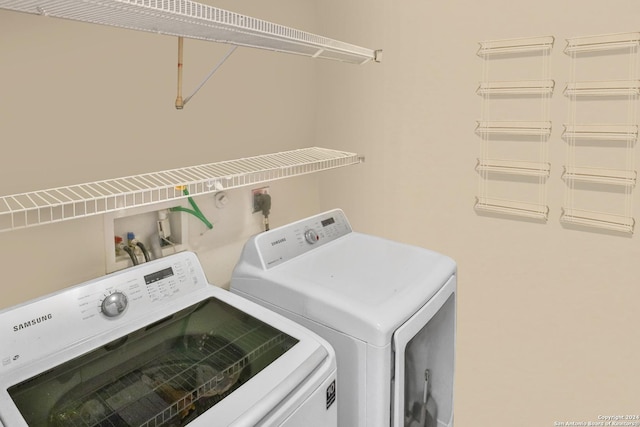 washroom with washing machine and dryer