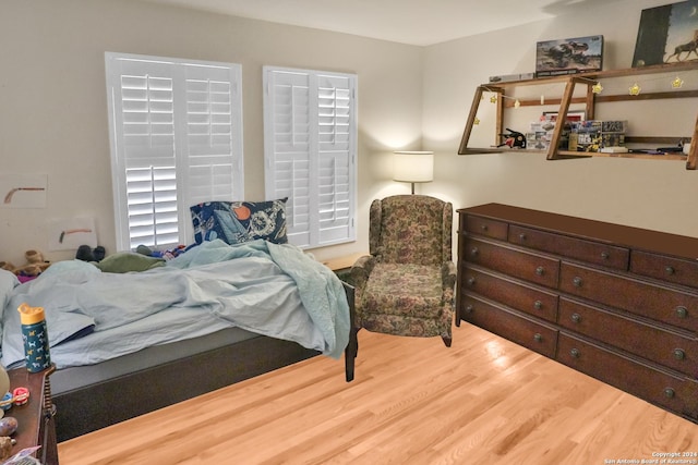 bedroom featuring wood finished floors