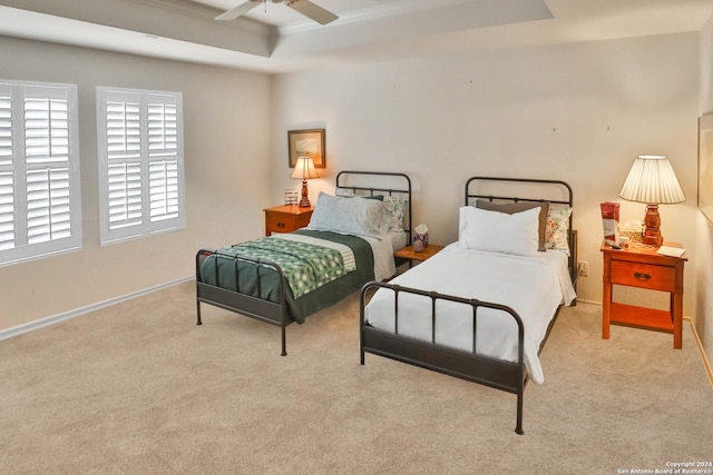 bedroom featuring carpet flooring, baseboards, crown molding, and ceiling fan