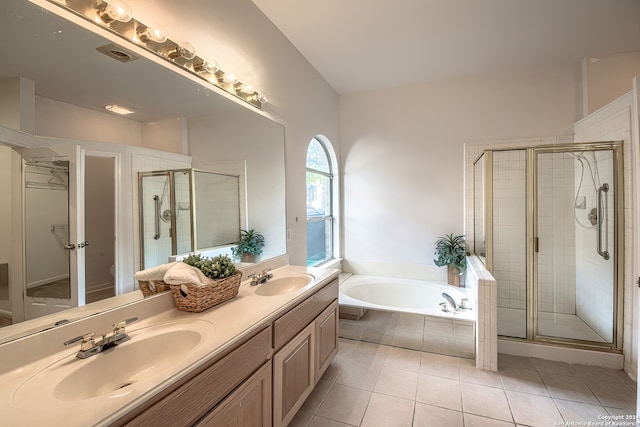 bathroom featuring vanity, tile patterned floors, and shower with separate bathtub