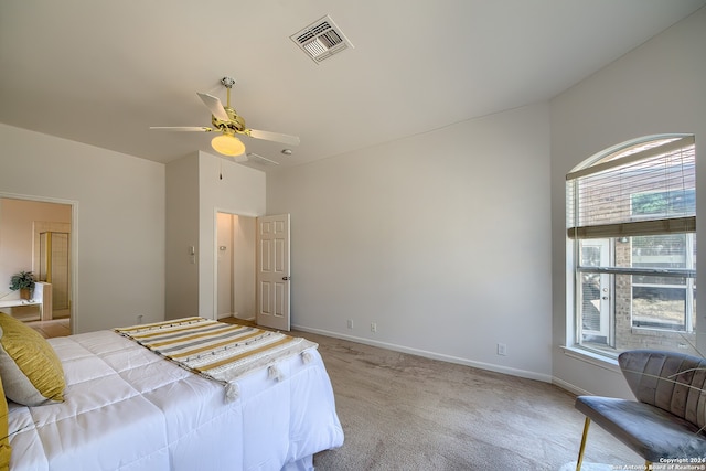 bedroom featuring multiple windows, light colored carpet, and ceiling fan