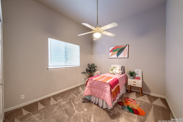 bedroom with ceiling fan, high vaulted ceiling, and carpet flooring