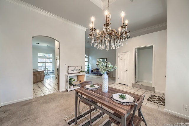 carpeted dining room featuring crown molding