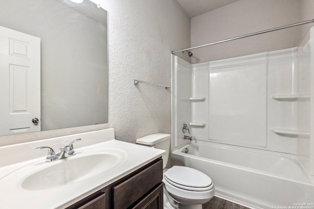 full bathroom with washtub / shower combination, hardwood / wood-style floors, vanity, and toilet