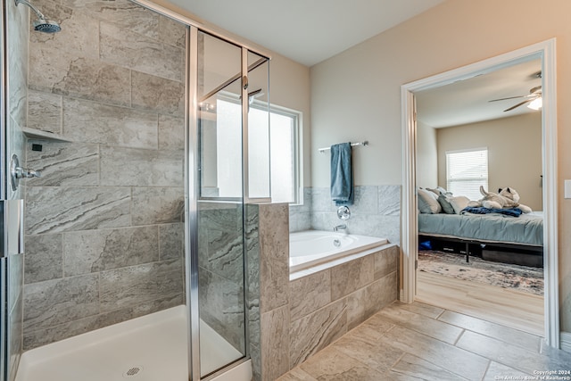 bathroom with independent shower and bath and ceiling fan