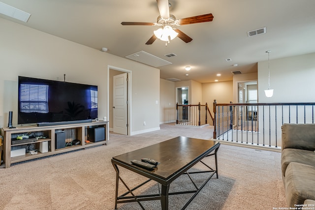 carpeted living room featuring ceiling fan