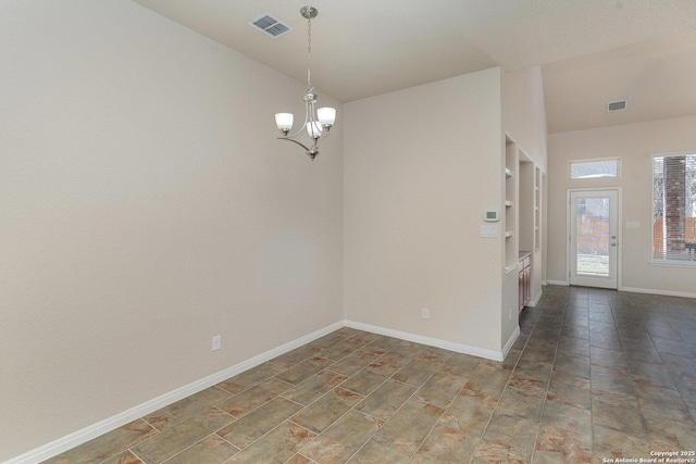 unfurnished room featuring visible vents, baseboards, lofted ceiling, and an inviting chandelier