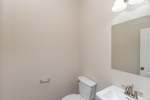 bathroom featuring a sink and toilet