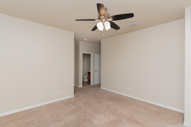 unfurnished room with visible vents, baseboards, ceiling fan, and light carpet
