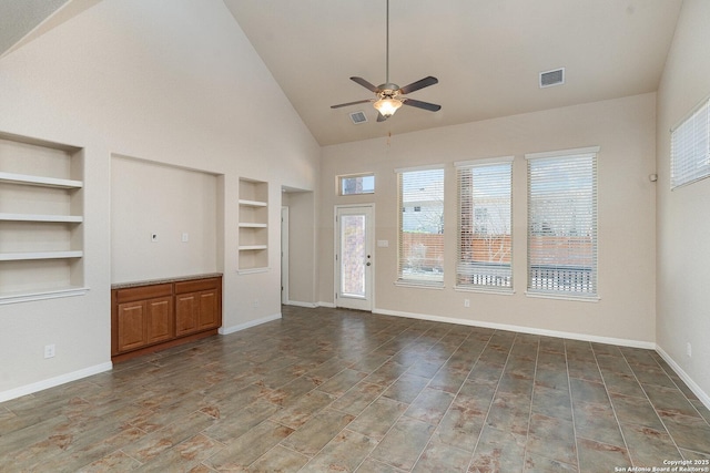 unfurnished living room featuring visible vents, a ceiling fan, high vaulted ceiling, and built in shelves