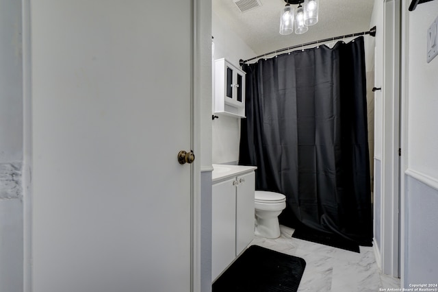 bathroom with vanity, a shower with shower curtain, a textured ceiling, and toilet