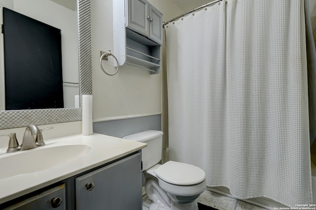 bathroom with vanity, toilet, and a shower with shower curtain