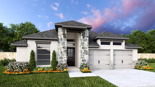 view of front facade with a garage and a lawn