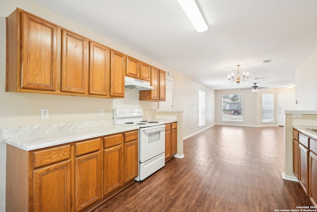 kitchen featuring white range with electric stovetop, decorative light fixtures, ceiling fan with notable chandelier, and dark hardwood / wood-style flooring