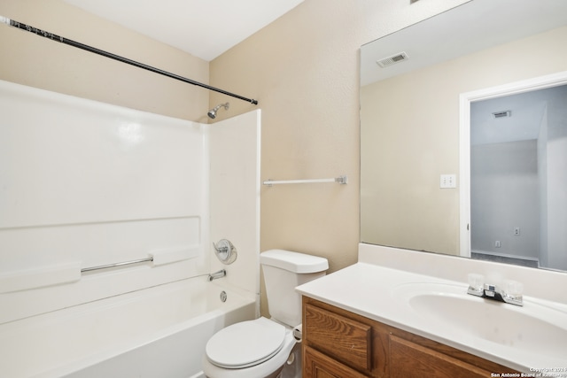 full bathroom with bathtub / shower combination, vanity, and toilet