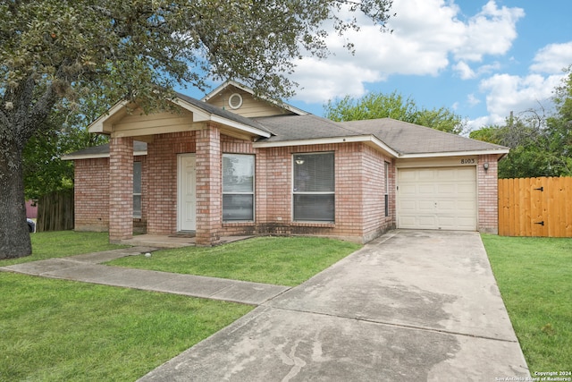 single story home with a front yard and a garage