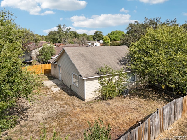 view of side of property featuring central AC unit