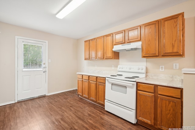 kitchen with white electric range oven and dark hardwood / wood-style floors