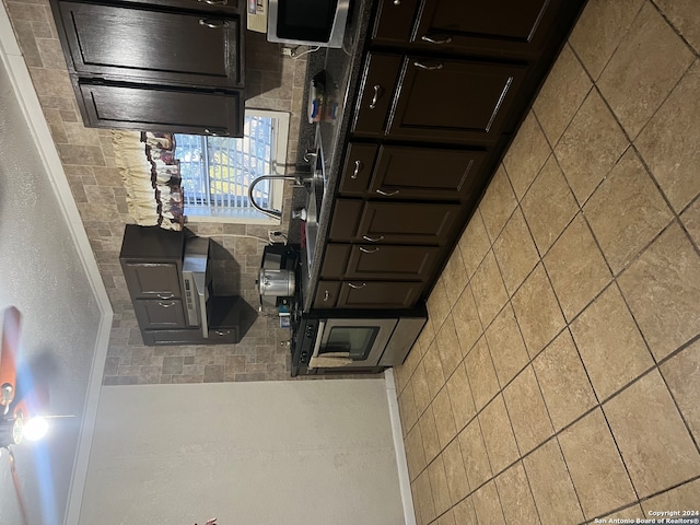 kitchen with dark brown cabinetry