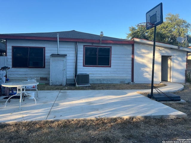 back of property featuring a patio and central AC