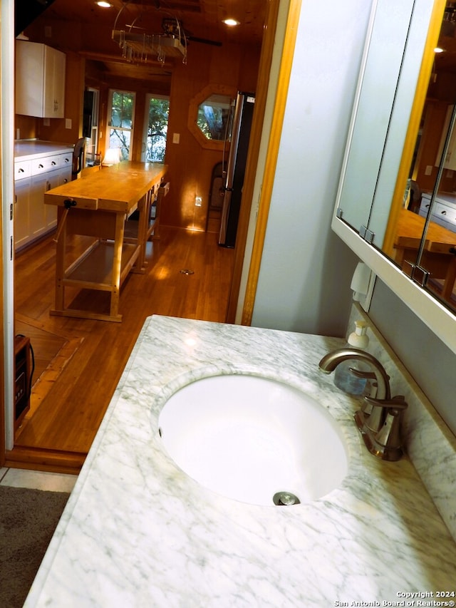 bathroom featuring vanity and wood-type flooring