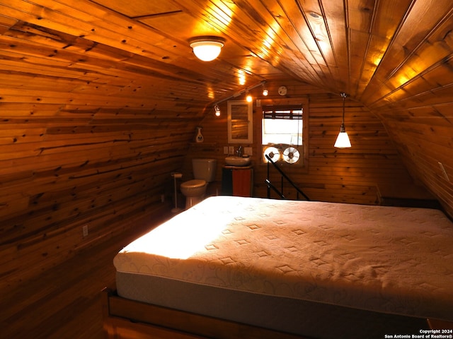 bedroom featuring wood ceiling, lofted ceiling, and wooden walls