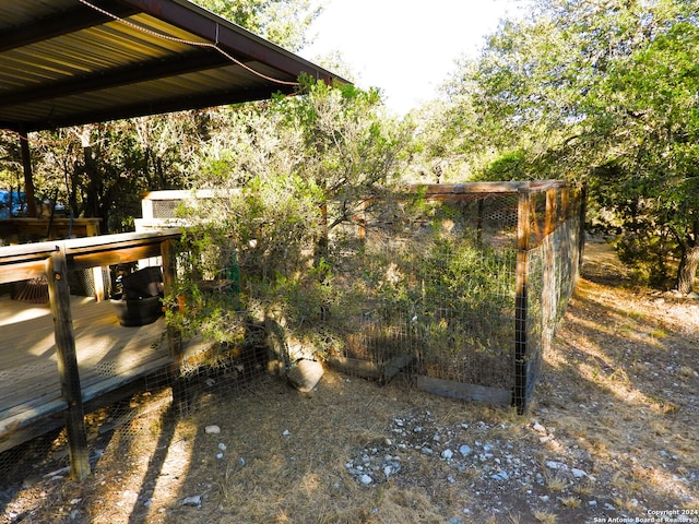 view of yard with a wooden deck