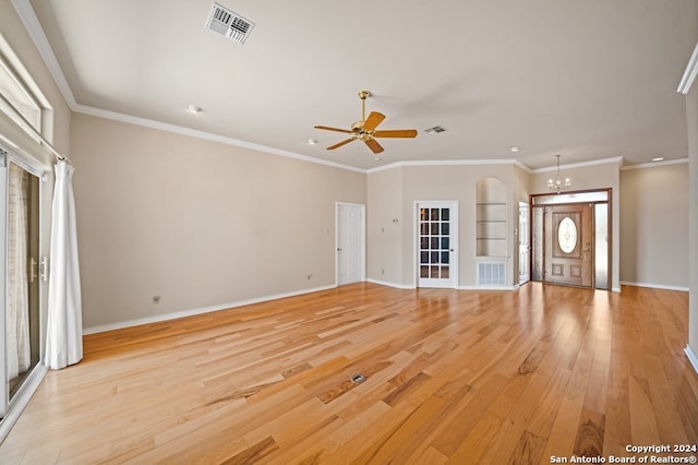 unfurnished living room with light hardwood / wood-style floors, ornamental molding, and ceiling fan with notable chandelier