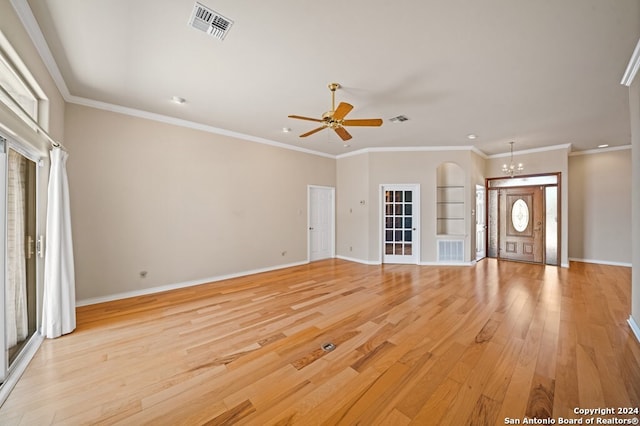 2029 Crown Rdg, Kerrville, TX 78028 - unfurnished living room with baseboards, visible vents, ceiling fan with notable chandelier, and light wood-style flooring