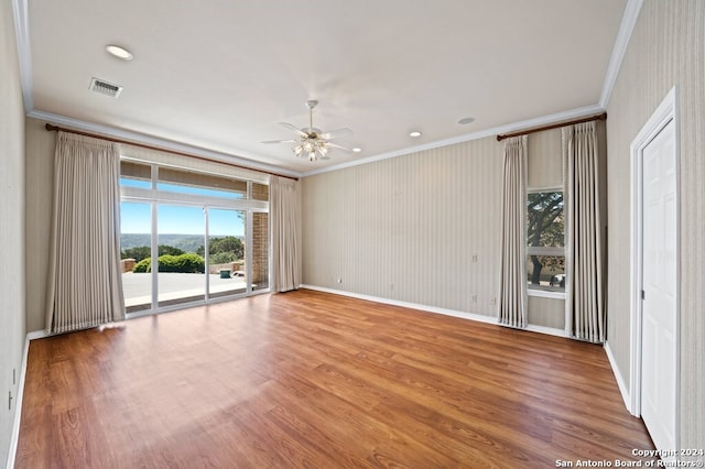 unfurnished room featuring ceiling fan, crown molding, and hardwood / wood-style floors