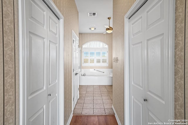 hall with hardwood / wood-style flooring