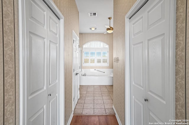 2029 Crown Rdg, Kerrville, TX 78028 - corridor featuring visible vents, wallpapered walls, and wood finished floors